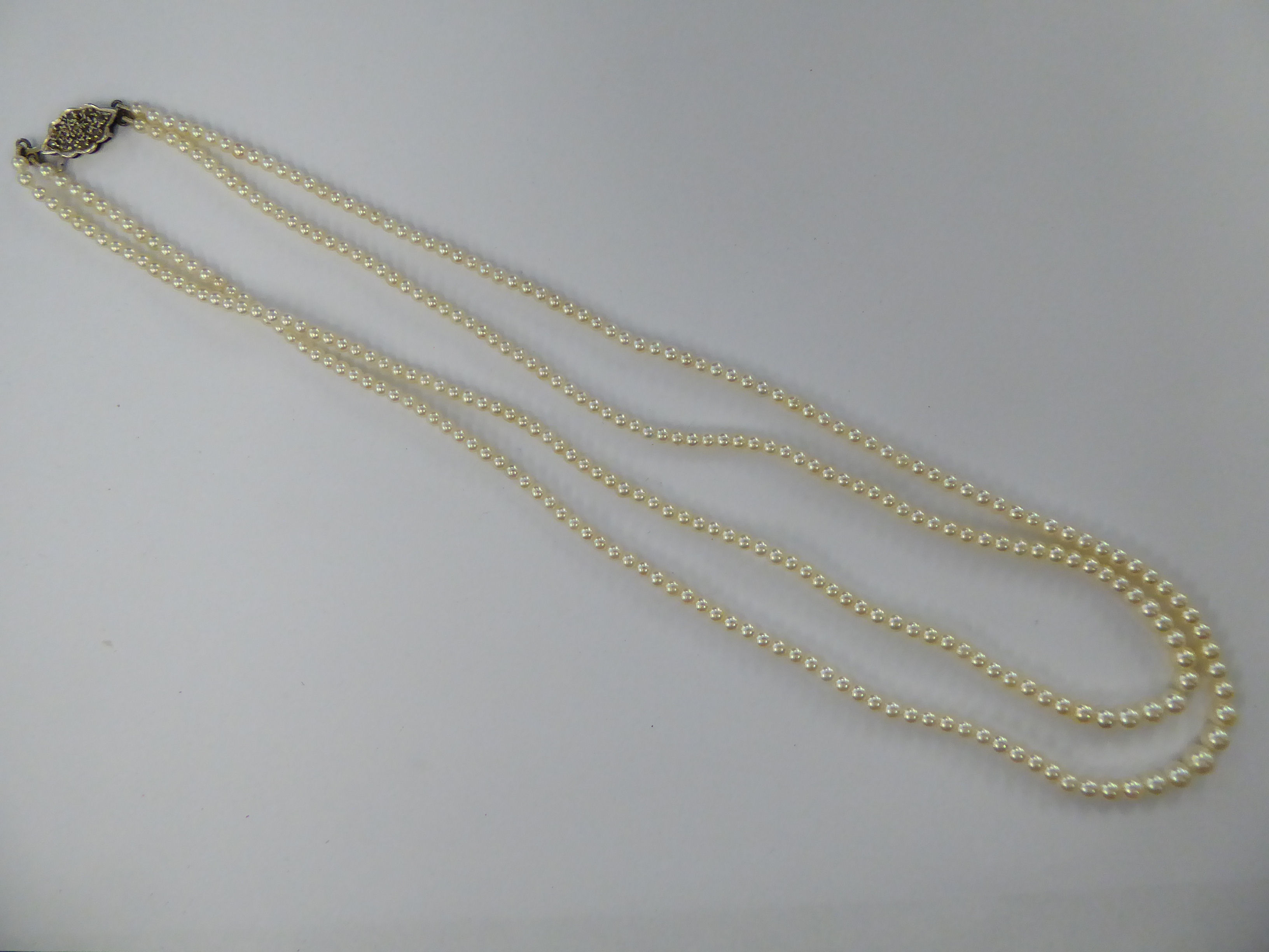 An early 20thC double row pearl necklace 11