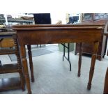 An early 20thC mahogany card table, the rotating, foldover top enclosing a green baize lining,