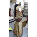 A 1960s stone coloured pottery table lamp of irregular three-part form with incised,