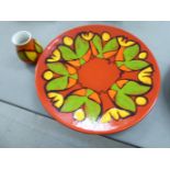 A Poole pottery Agean pattern charger, decorated in bright coloured designs,