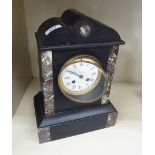 A 1930s marble and black slate cased mantel clock; the movement faced by a white enamel Roman dial,