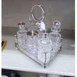 An early 20thC Walker & Hall silver plated cruet with six glass receptacles 9.