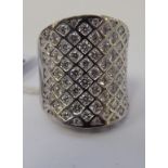 An 18ct white gold pave set diamond ring 11