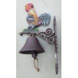 A cast iron door bell, fashioned as a cockerel,