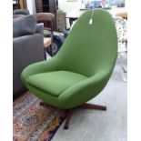 A 1960s/70s moulded, one piece, bucket design chair, rotating on a splayed quatrefoil base,