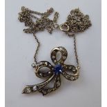 A bi-coloured metal pendant, set with a sapphire and diamonds,
