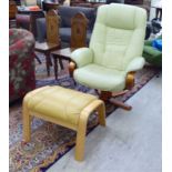 A modern pale lime green soft hide upholstered recliner armchair,