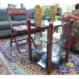 Small furniture: to include a stained beech and smoked glass, four tier audio stand,