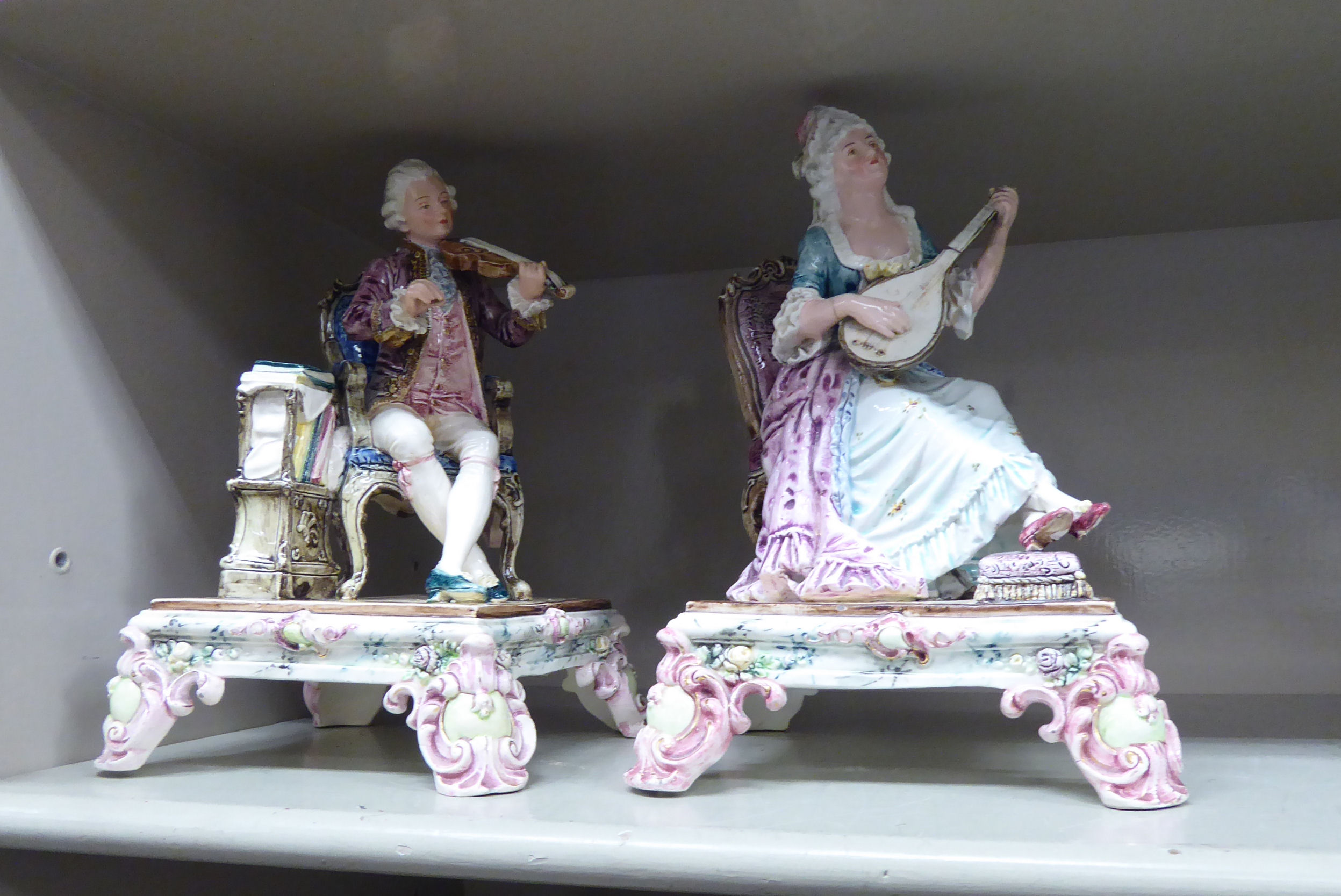 Two similar early 20thC European porcelain figures, a man and woman wearing period costume, - Image 2 of 2