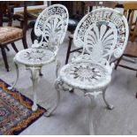 A pair of Victorian style white painted alloy framed terrace chairs with anthemion designs to the