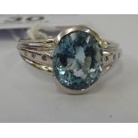 An 18ct white gold ring, set with an aquamarine,