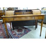 A modern French hardwood dressing table, the centre with a slide and lift mirror,