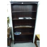 A modern Stag mahogany finished open front bookcase with four height adjustable shelves,
