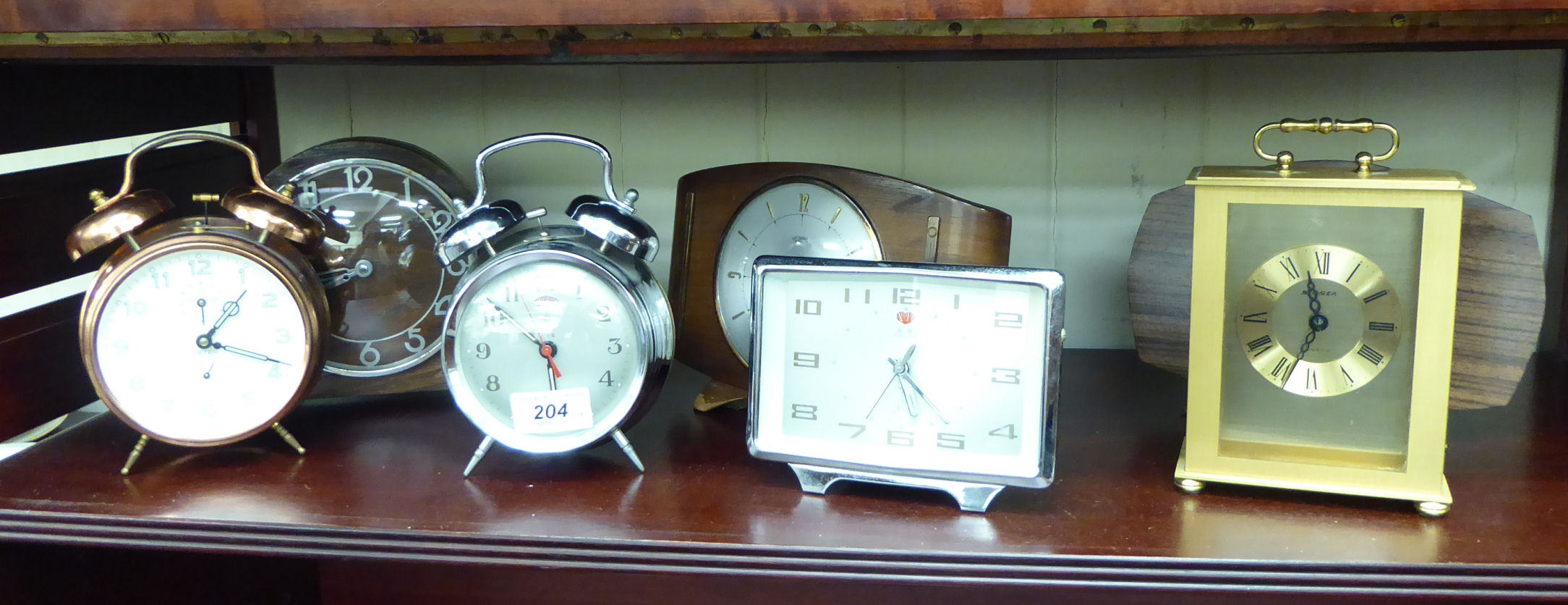 Seven mid 20thC - present day clocks and timepieces: to include a stainless steel cased Polaris
