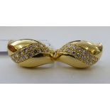 A pair of 18ct gold and diamond set earrings of free-flowing tear-drop form 11