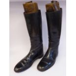 A pair of gentleman's black leather riding boots (probably size 10/11) with three-part wooden