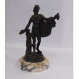 A Grand Tour patinated iron classical statuette, featuring a standing youth, on a turned,