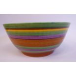 A Clarice Cliff honey glazed Bizarre pottery bowl, decorated in colours with brown, green,