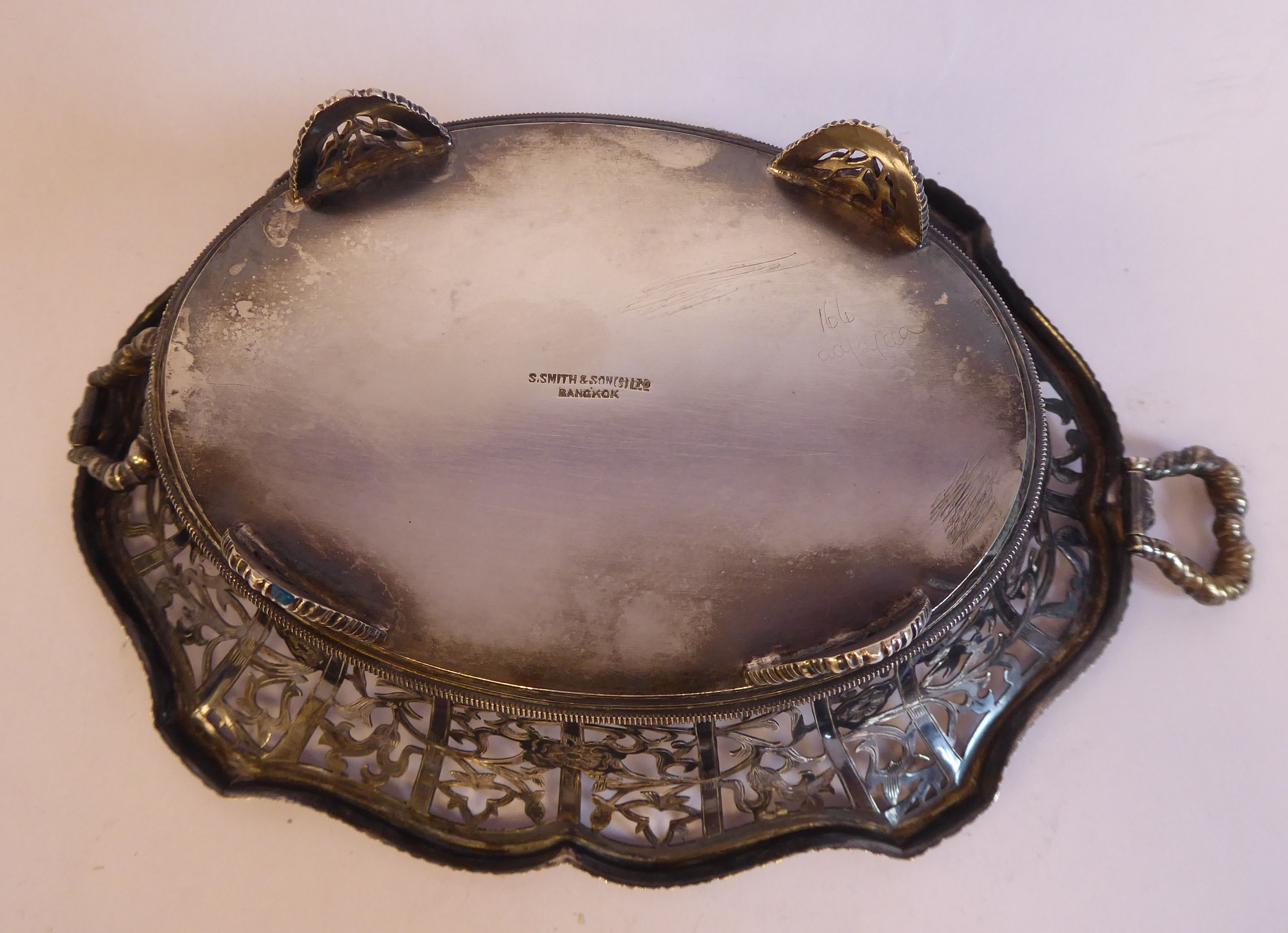 A late 19th/early 20thC Thai silver coloured metal oval basket with decoratively pierced, engraved, - Image 6 of 7