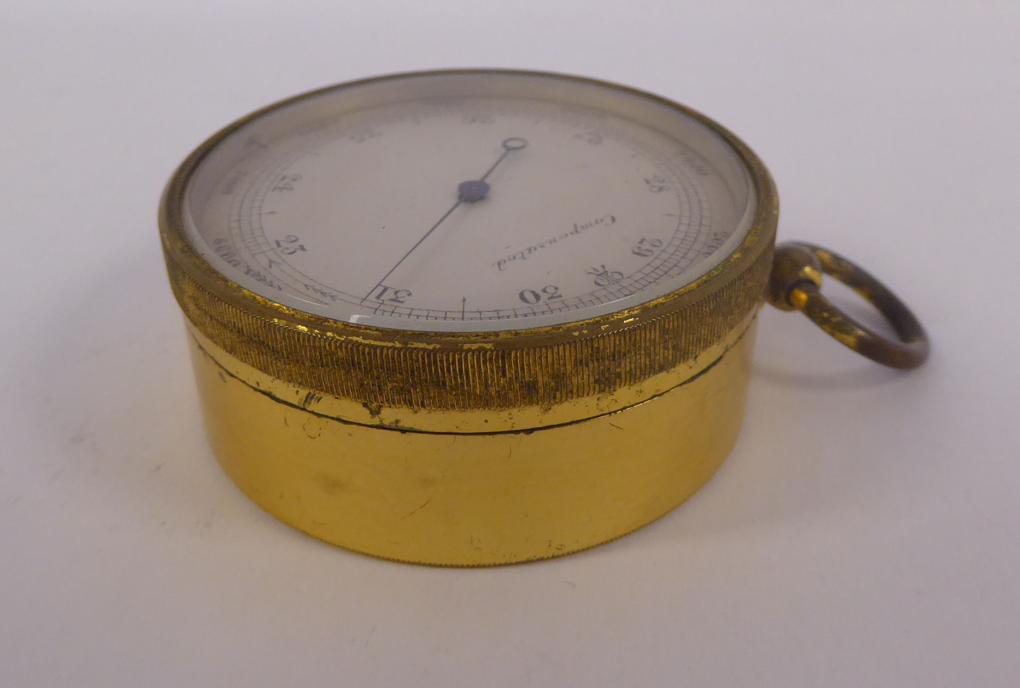 A late 19thC lacquered gilt metal drum cased pocket barometer with a silvered steel dial, - Image 4 of 5