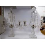 A pair of early 20thC cut crystal candelabra,