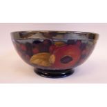 A Moorcroft pottery footed fruit bowl, decorated in a version of the Pomegranate design,