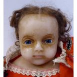 A late 19thC wax head doll with fixed glass eyes,