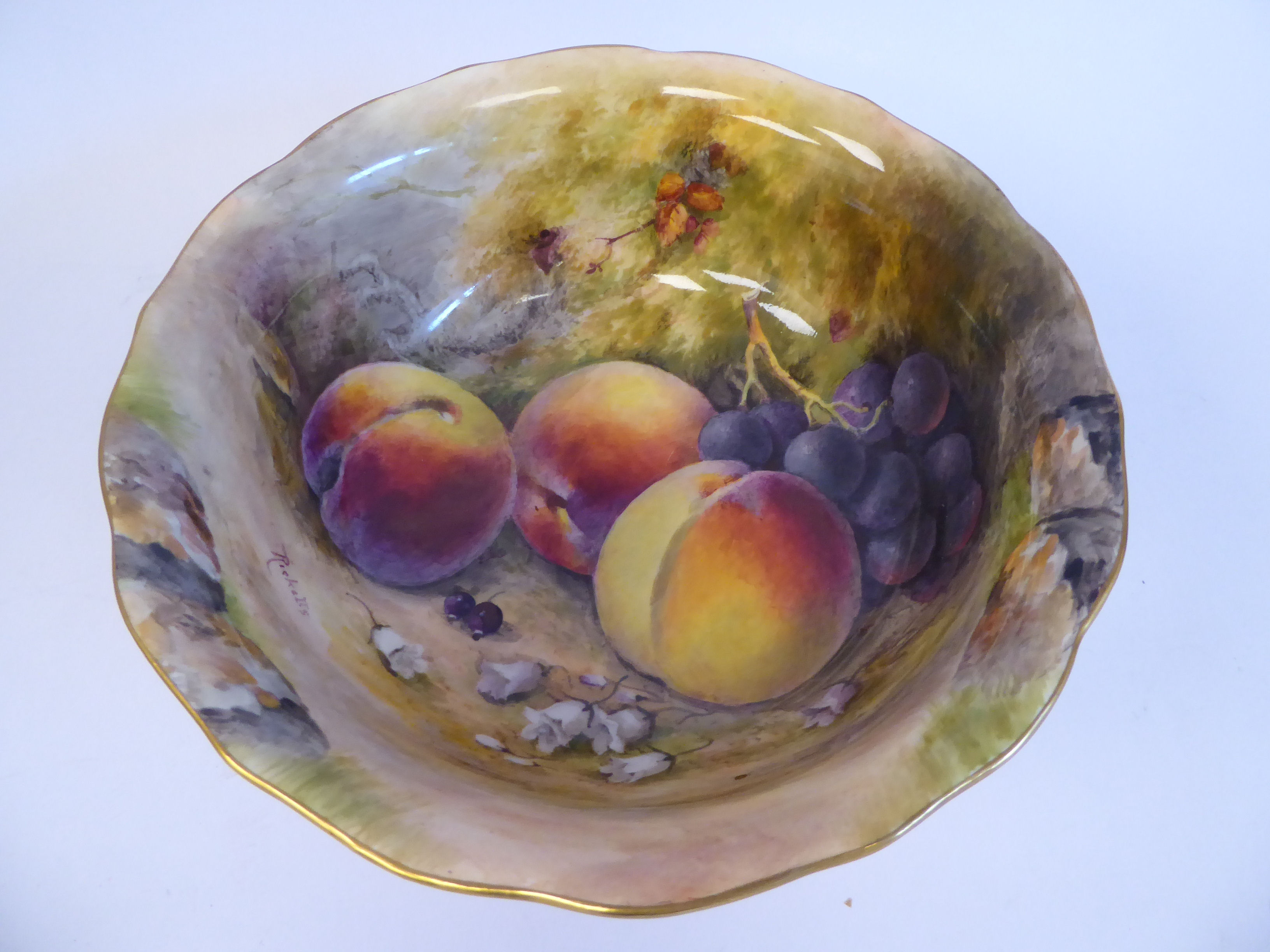 A Royal Worcester china footed bowl, decorated with soft fruit,