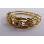 An 'antique' 9ct gold engraved, double twist wire hinged bracelet,