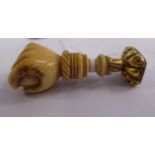 A carved ivory and yellow metal letter seal,