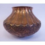 A late 19th/early 20thC Persian copper vase of squat, bulbous form,