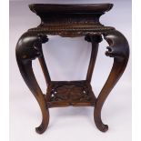 A late 19thC Oriental carved hardwood table stand of square form,