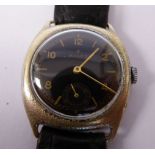 A 1920s/30s Rolex stainless steel cased wristwatch, faced by a black dial with gilded batons,