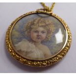 A late Victorian glazed yellow metal framed, silver cased circular pendant,