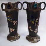 A pair of early 20thC Bretby bronze effect pottery vases of tapered, twin handled form,