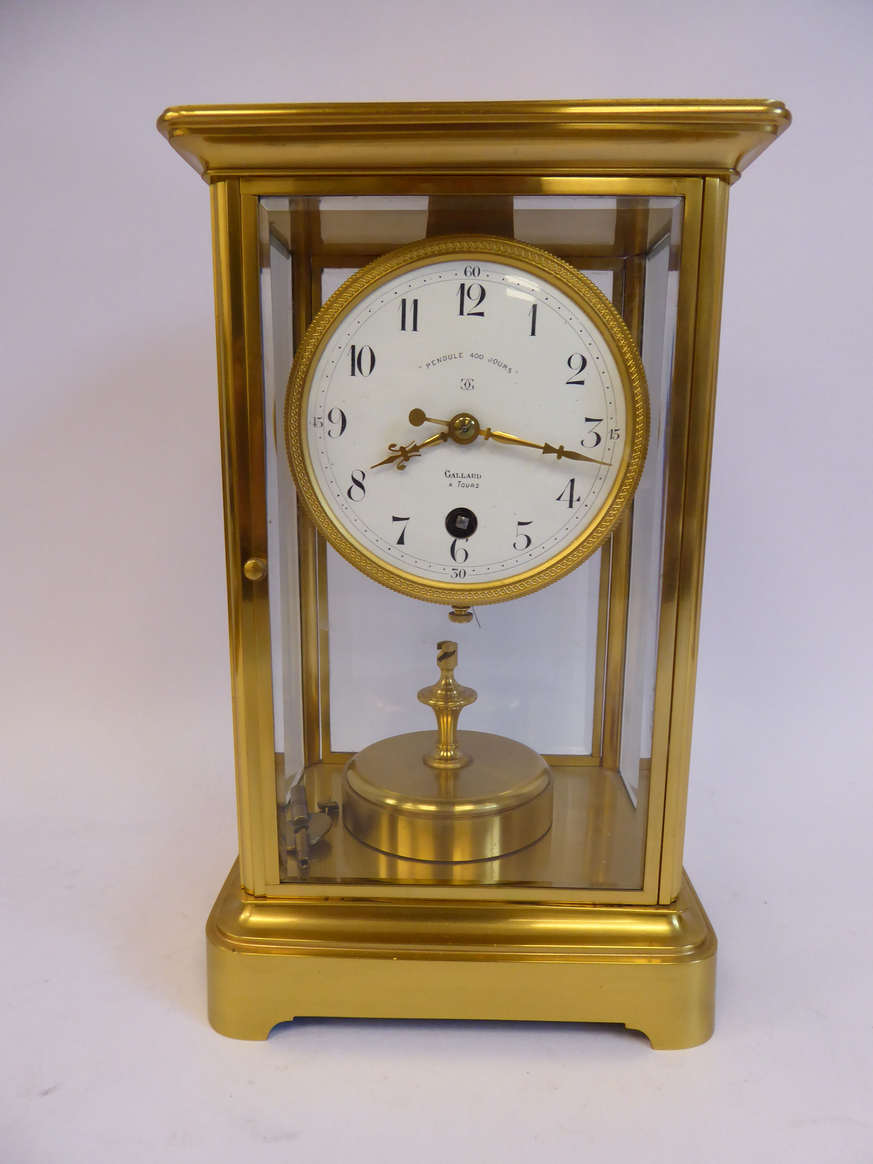 An early/mid 20thC French lacquered brass cased, four glass mantel timepiece,
