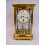An early/mid 20thC French lacquered brass cased, four glass mantel timepiece,