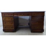 A late Victorian mahogany partner's' desk,