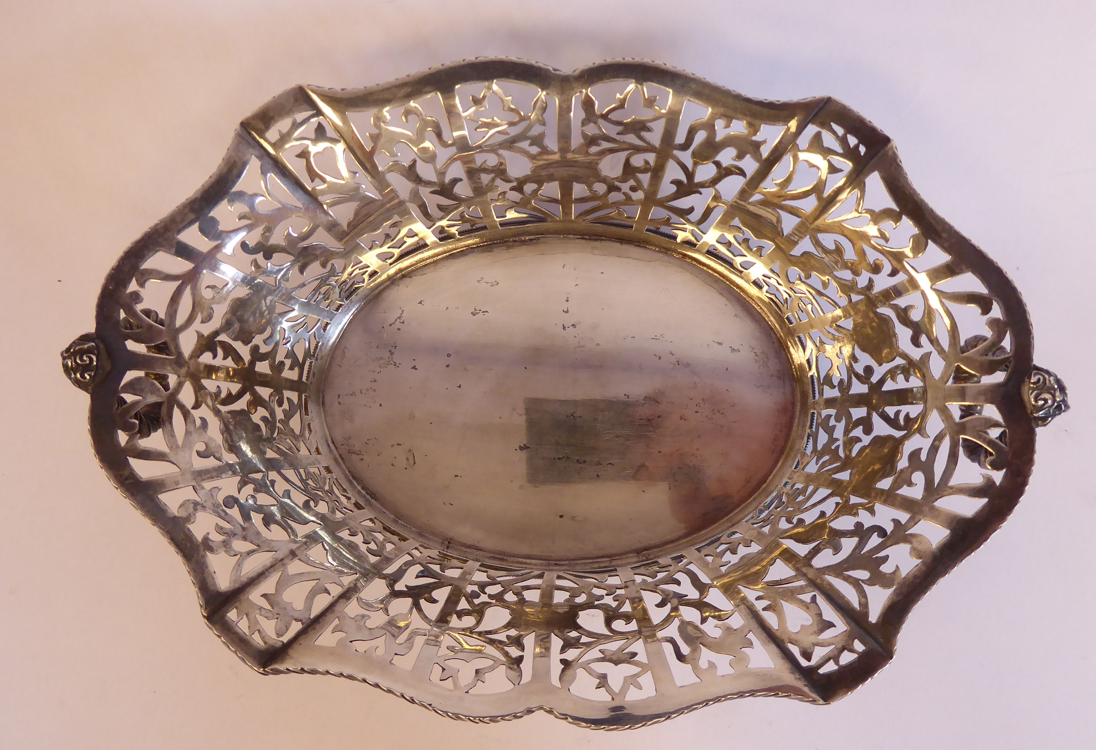 A late 19th/early 20thC Thai silver coloured metal oval basket with decoratively pierced, engraved, - Image 5 of 7