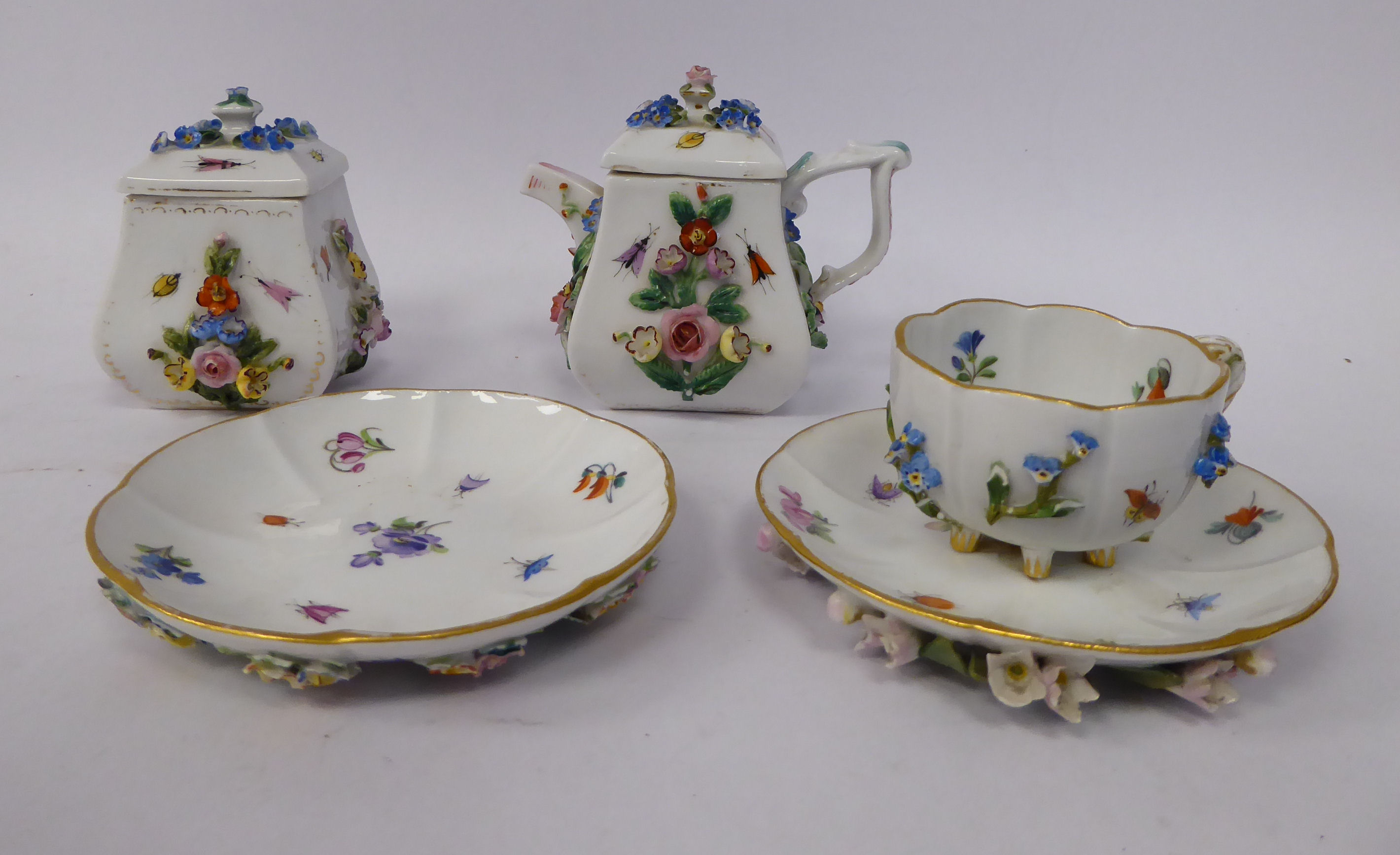 A late 19thC Meissen porcelain coffee cup and saucer,