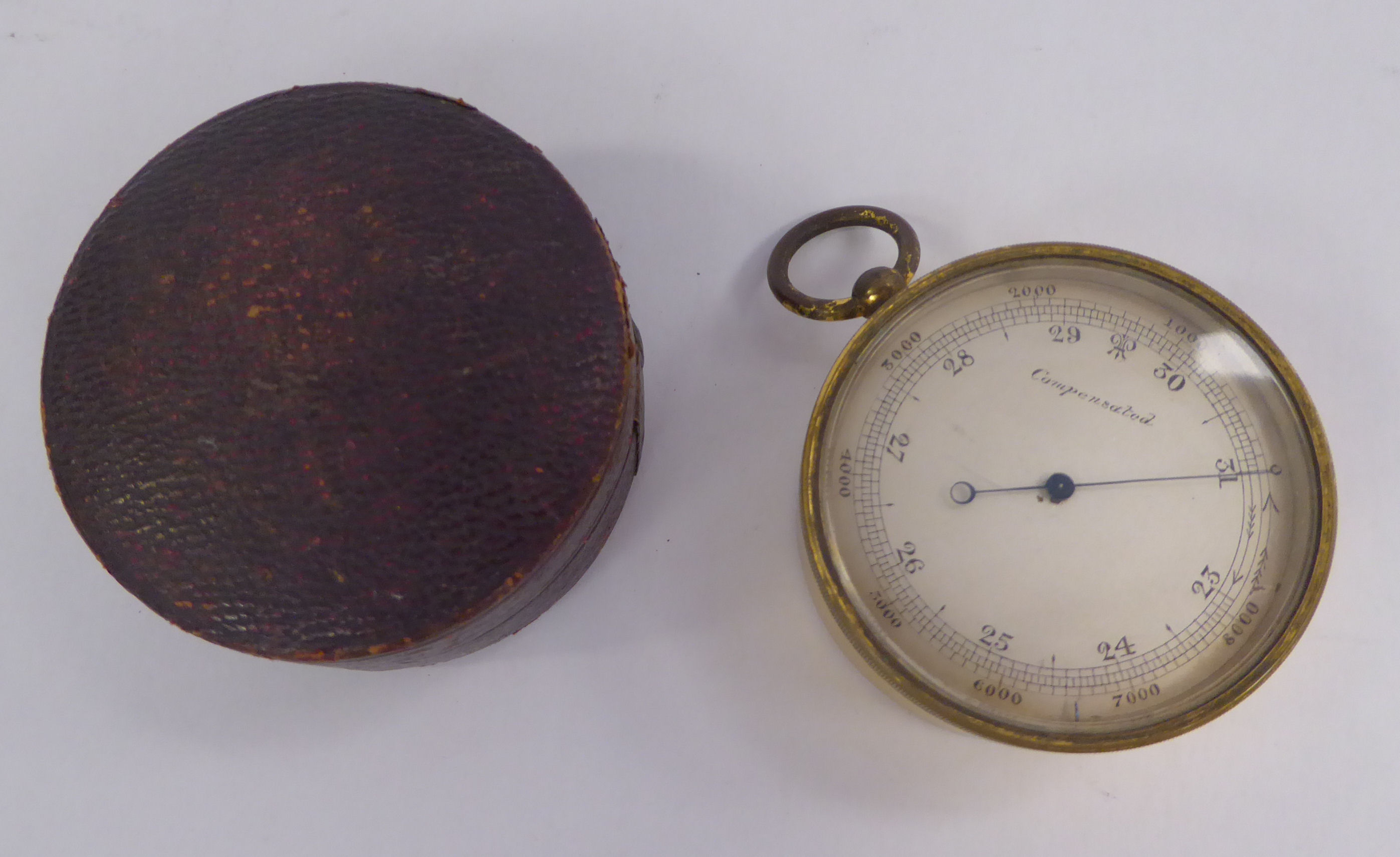 A late 19thC lacquered gilt metal drum cased pocket barometer with a silvered steel dial, - Image 2 of 5