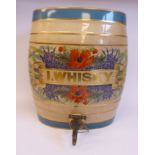A late 19thC cream coloured pottery, oval barrel design bar room dispenser,