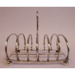A mid Victorian silver six division hooped wire toastrack, on a cast,
