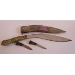 An early 20thC kukri with two part horn handle, the scratch engraved blade 11''L,