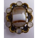 A Scottish yellow metal brooch, set with a banded agate tablet,