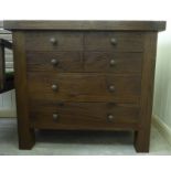 A modern rustically finished stained hardwood dressing chest with panelled sides and four graduated