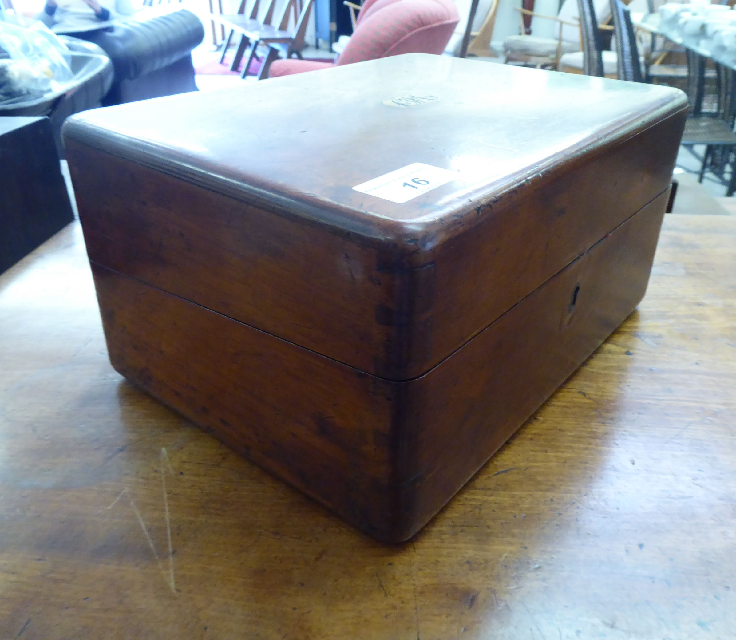 A late Victorian mahogany writing slope, the hinged lid,