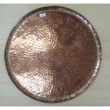 A John Pearson Newlyn School spot-hammered copper tray with a raised border bears an impressed