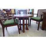 A modern rustically finished, stained hardwood conservatory table, raised on a pegged,
