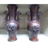A pair of mid 20thC Chinese bronze twin handled vases, decorated with birds and flora 5.